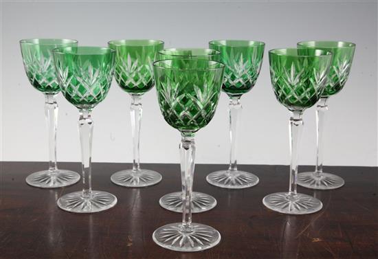 A set of eight green bowled cut glass hock glasses